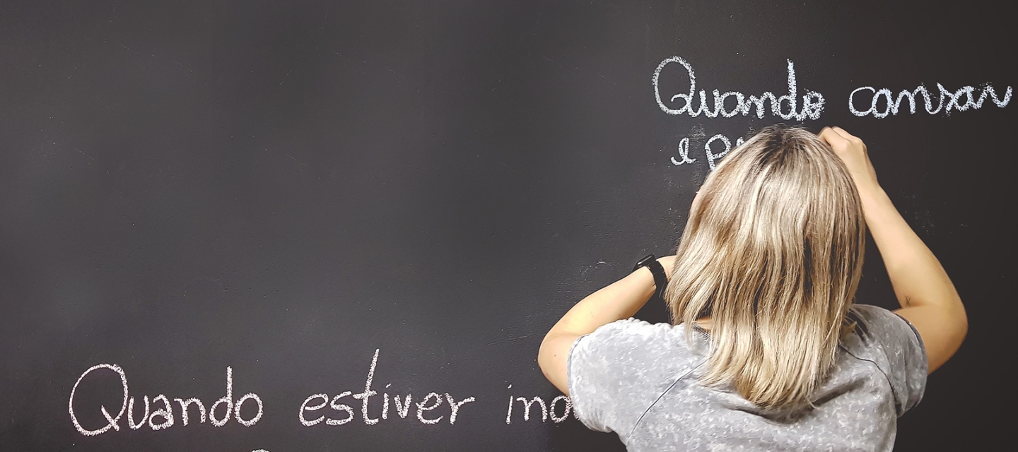 Teacher at a chalkboard