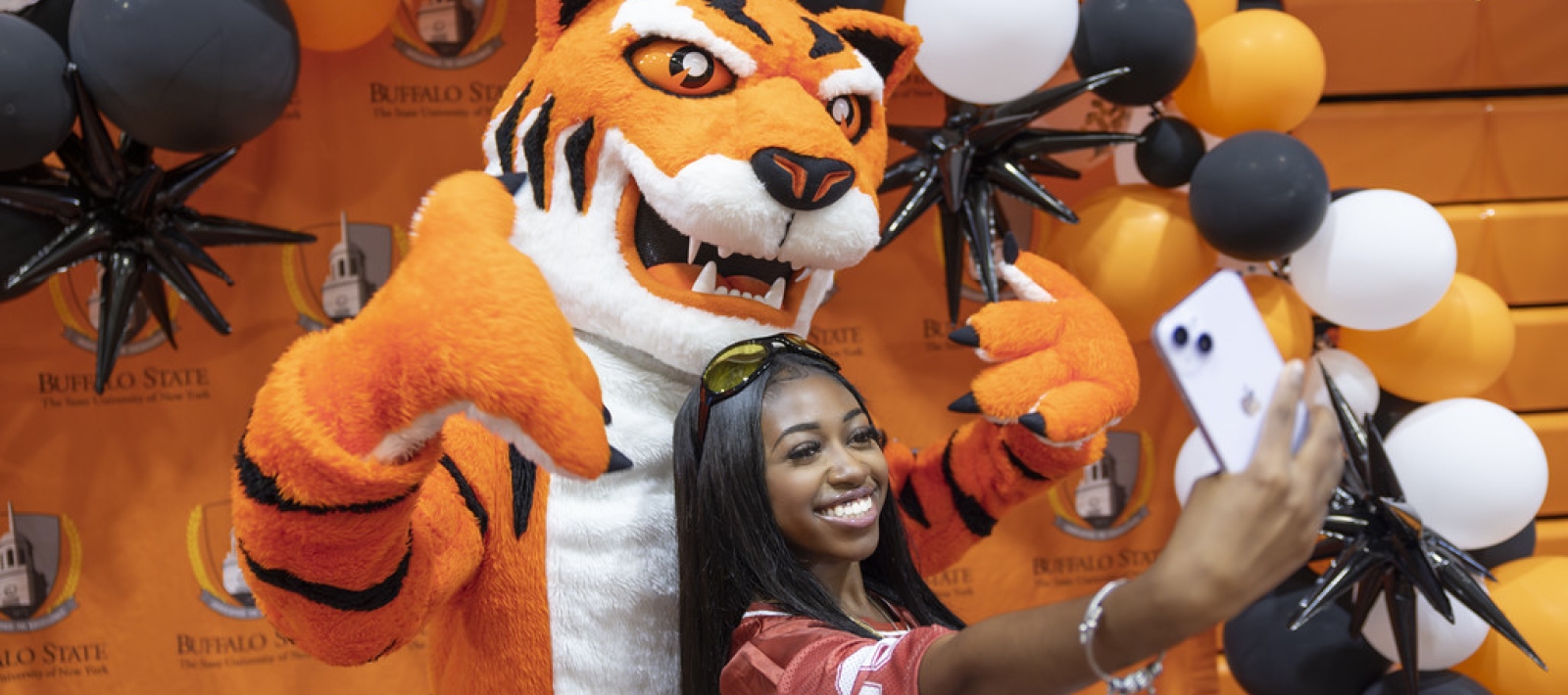 Student with Buffalo State mascot